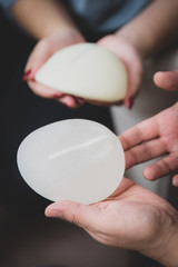 Plastic surgeon and patient discuss choice of breast implants after mastectomy or for breast...