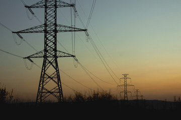 electricity pylons at sunset