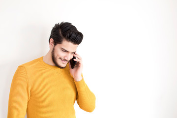 portrait of handsome man talking by phone