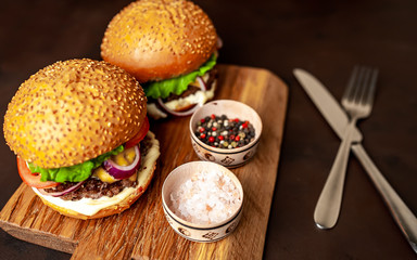 Two Delicious Fresh Homemade Burger on a Cutting Board