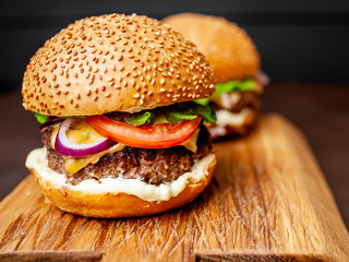 Two Delicious Fresh Homemade Burger on a Cutting Board