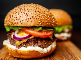 Two Delicious Fresh Homemade Burger on a Cutting Board