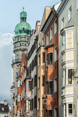 Fototapeta premium INNSBRUCK, AUSTRIA - JANUARY, 01 2019: The city tower and colourful buildings in Herzog-Friedrich-Strasse, in the Old Town (Altstadt) - Innsbruck, Austria 