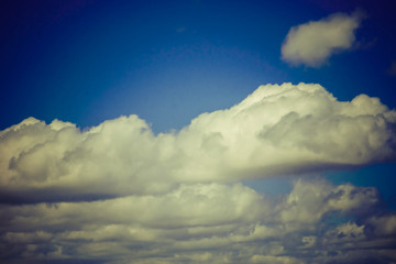 Naklejka na ściany i meble blue sky with slightly grey clouds
