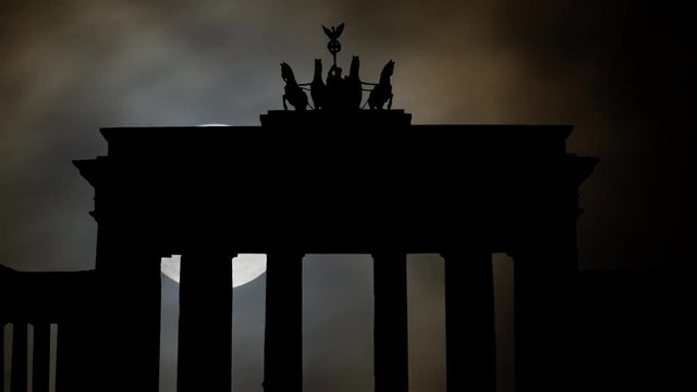 The Brandenburg Gate, Icon Of Berlin And Germany By Night, With Moon Germany