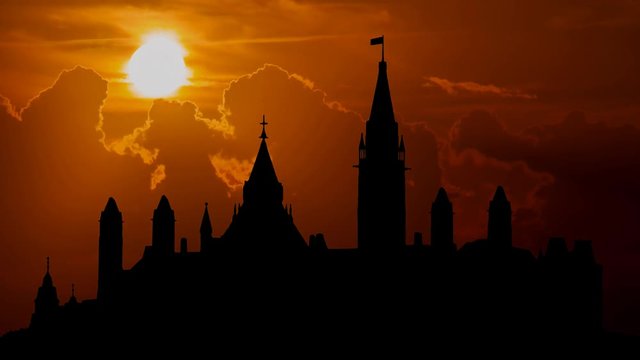 Parliament Hill (Colline du Parlement) and Its Gothic revival suite of Buildings in Silhouette at Sunset, Ottawa, Ontario, Canada