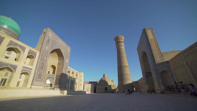 Panoramic view of the complex Poi Kolon at sunset in Bukhara, Uzbekistan. UNESCO world Heritage. slow motion video