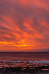 Fototapeta premium Orange sunset over the ocean