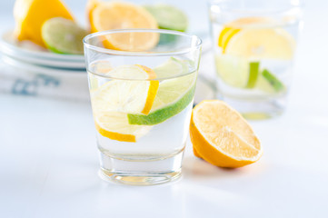 glass of water with lemon and lime