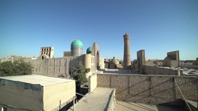 Panoramic view of the complex Poi Kolon at sunset in Bukhara, Uzbekistan. UNESCO world Heritage. slow motion video