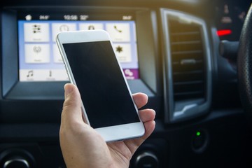 Using a smart phone to connect the signal in the car Phone signal. Concept communication technology,road trip, travel.
