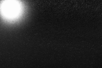 background. protective bubble film illuminated by a flashlight. imitation of the universe.
