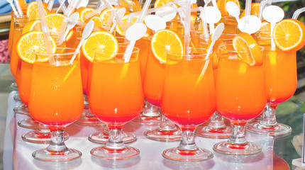 Fresh cocktail with orange, mint and ice, selective focus