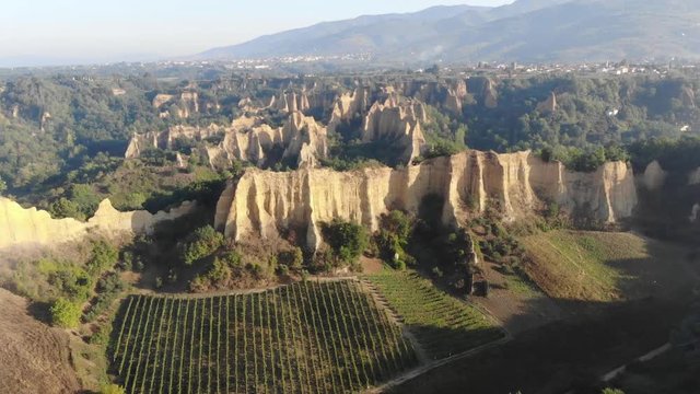 Aerial View Of Le Balze Del Valdarno, Giant Ancient Hills Of Piantravigne In Tuscany With Vineyards, Italy