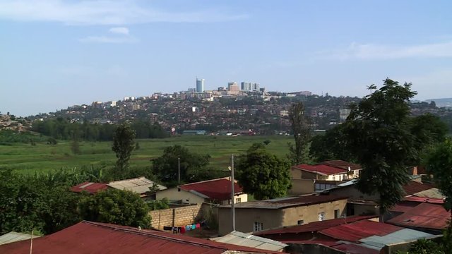 Slow Zoom in from a hill to downtown Kigali skyline - Rwanda.