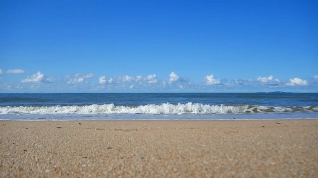 Summer Beach Sand with blue sky. Panning video