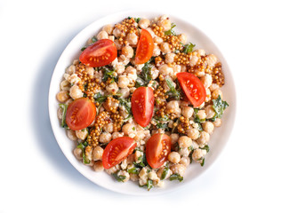 Vegetarian salad of boiled chickpeas, cheese, arugula, mustard and cherry tomatoes isolated on white background.