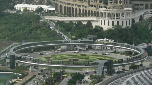Cars in traffic drive in a roundabout circus in Macao