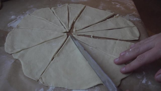 Girl cooking homemade pastery and lining it on a tray for Christmas.