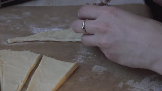 Girl cooking homemade pastery and lining it on a tray for Christmas.