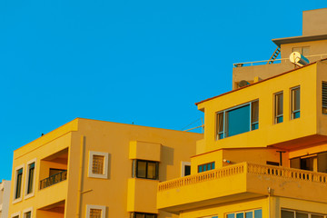 Yellow houses on a coast  of Rhodes Island, Greece