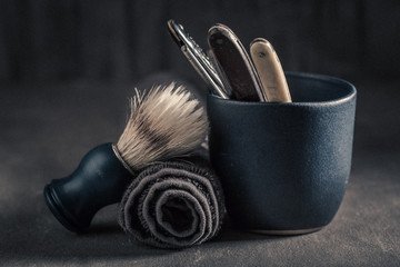 Unique barber equipment with old razor, soap and brush