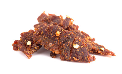 Pile of Red Pepper Beef Jerky on a White Background