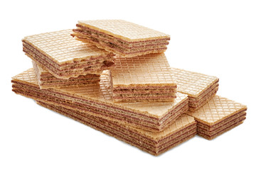 pile of rectangular shaped wafer biscuits and one broken halved into two pieces