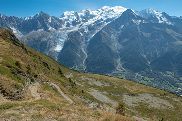 Footpath meanders downhill in foreground with views of Mont Blanc