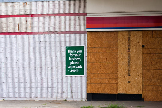 A Shuttered Business With An Ironic Sign Posted.