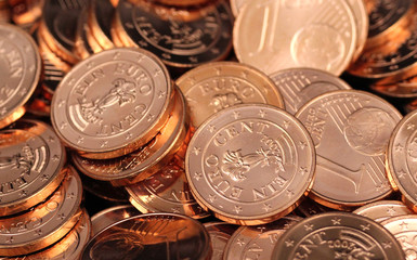 A pile of shiny new one Euro cent coins shot in extreme macro