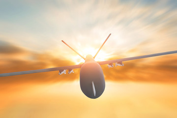 Military drone flight motion blur on sunset background. Close up view.