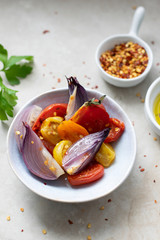 Freshly cooked onions and tomatoes in a bowl