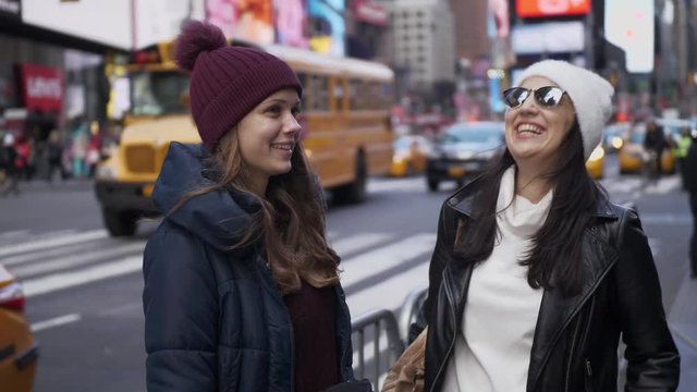 Two friends enjoy their vacation trip to New York