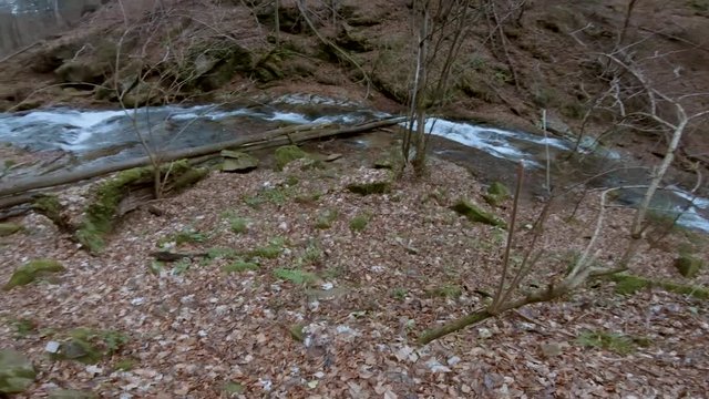 Feeling lost while hiking on the trail in Vintgar on a beautiful autumn day. Bistriski Vintgar Slovenia. Moving camera