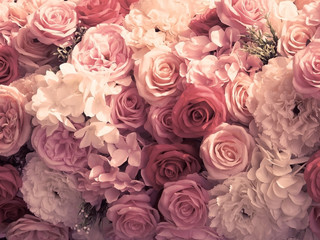 Artificial rose and carnation flowers bouquet vintage tone.