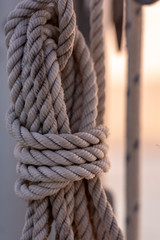 Fototapeta na wymiar closeup of rope on mast of sailboat