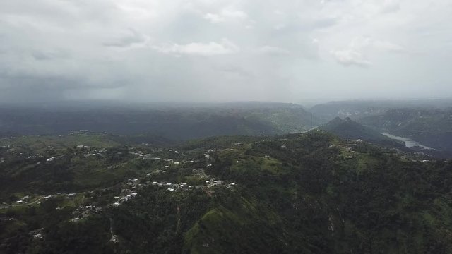 AERIAL: extreme wide pushing in toward the mountain tops of Utuado, Puerto Rico.