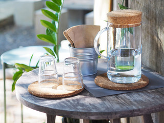 bottle of water and empty glasses