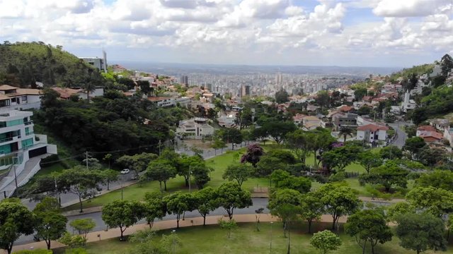 A Beautiful cityscape behind a park in Brazil - Aerial View - Dolly - Right 