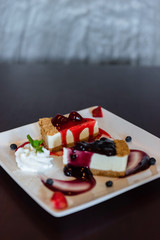 Slice strawberry and blueberry cheesecake with fresh strawberry and fruits.