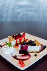 Cheesecake topped with fresh strawberry and blueberry