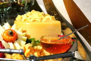 Buffet table, cheese and honey