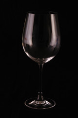 Glass cup on black background