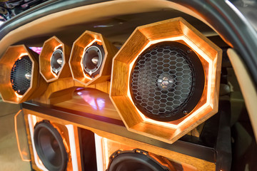 colorful lights of stereo and speakers in car in the night