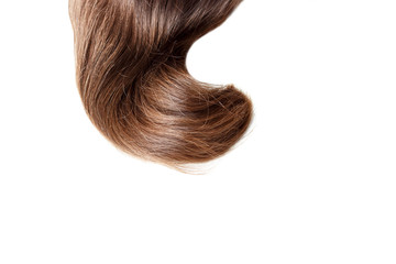 Naklejka premium A strand of light brown hair close up, isolated on white background