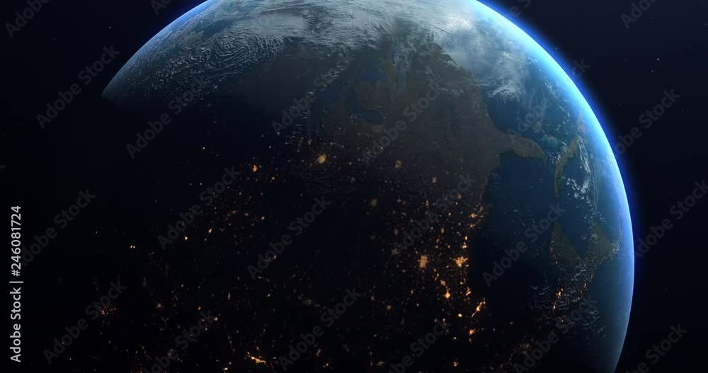 Wall mural a slow rotation of the earth, as it moves from day to night. earth rotating on its axis in black spa