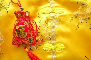 Red amulet bag. Chinese alphabet on red bag means good fortune and happinese. Chinese new year.
