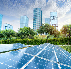 Ecological energy renewable solar panel plant with urban landscape landmarks