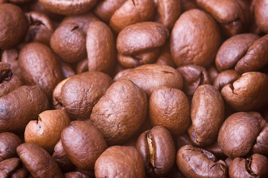 Roasted coffee beans, closeup. Background. © Sergej